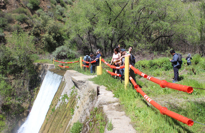 students admiring the water fall