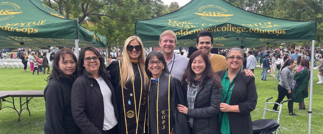 EOPS Office employees at graduation posing for a picture